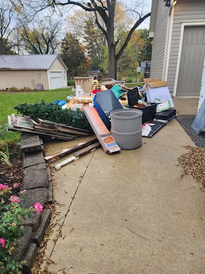 Dumpster being loaded with debris for Commercial Dumpster Rental in West Vero Corridor